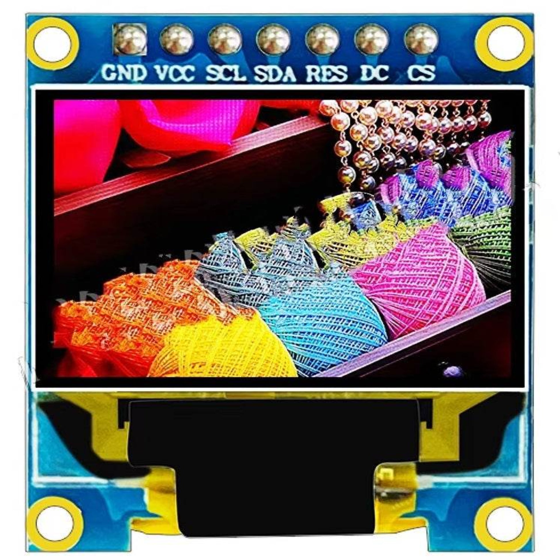 0.95 inch OLED monitor module SSD1331 SPI displaying colorful threads and decorative beads.