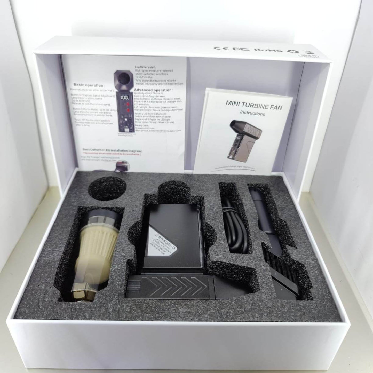 130,000 RPM Mini Turbo Jet Fan unboxing showing accessories, instruction manual, and packing.