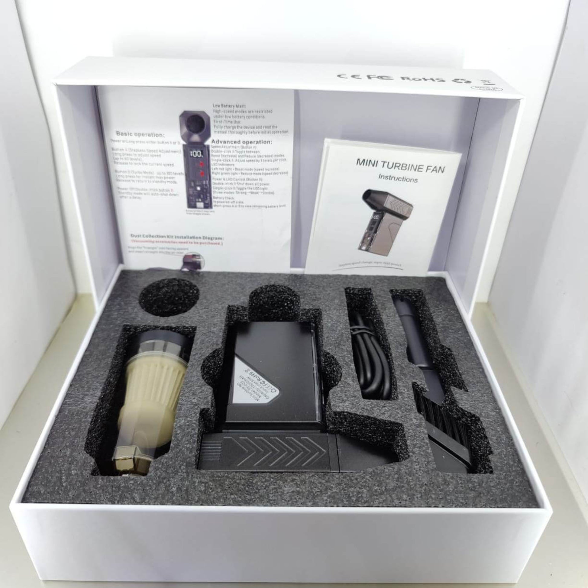 130,000 RPM Mini Turbo Jet Fan unboxing showing accessories, instruction manual, and packing.
