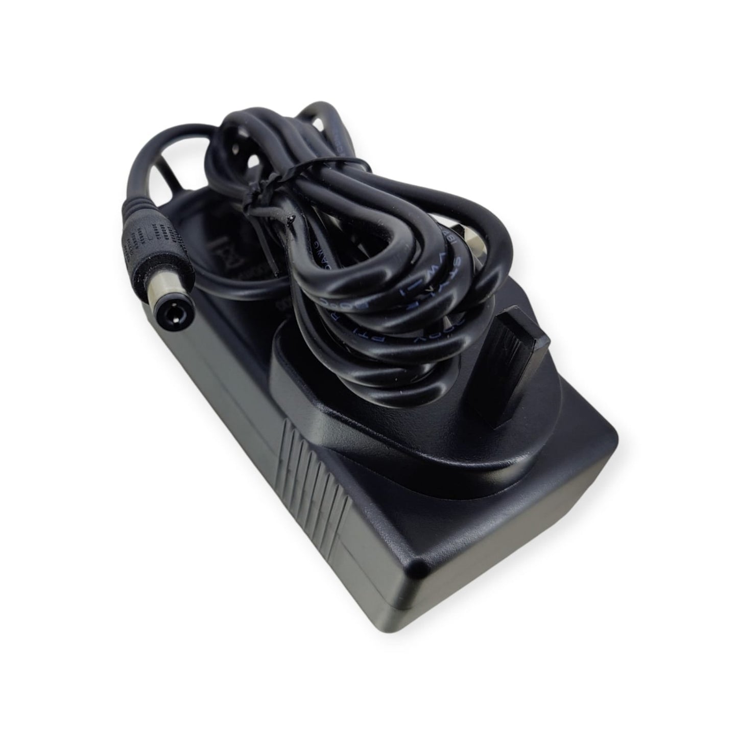 Top-down view of the 15V AC adapter highlighting the UK Type G plug and coiled power cord.