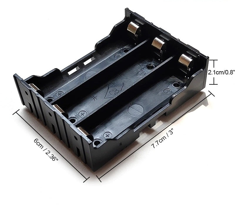 Angled view of an empty 3-slot 18650 battery holder showing the internal compartments and metal contacts.