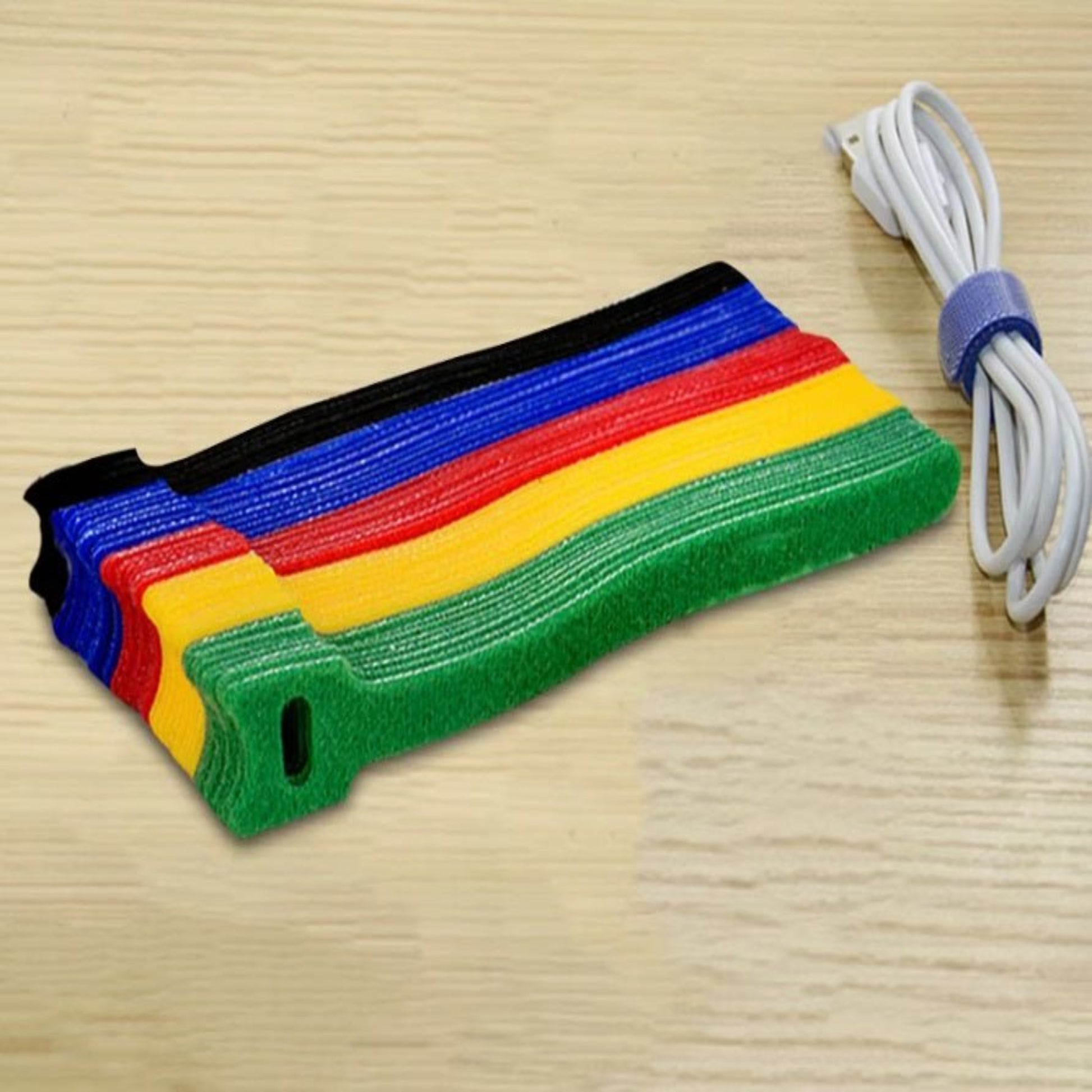 Colorful reusable nylon hook and loop cable ties for organizing wires and cables in various settings.