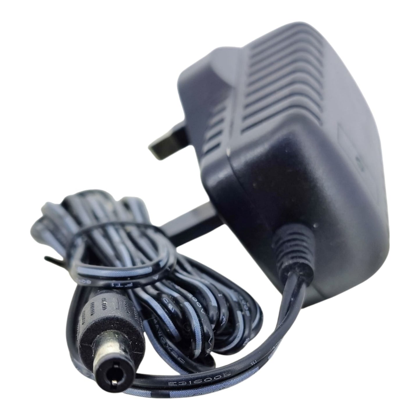 Angled view of the 9V 1.5A power adapter highlighting the 5.5mm x 2.1mm DC barrel plug connector.