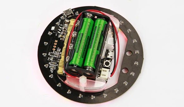 Micro:bit V2 RGB ring LED expansion board with battery compartment and programmable components.