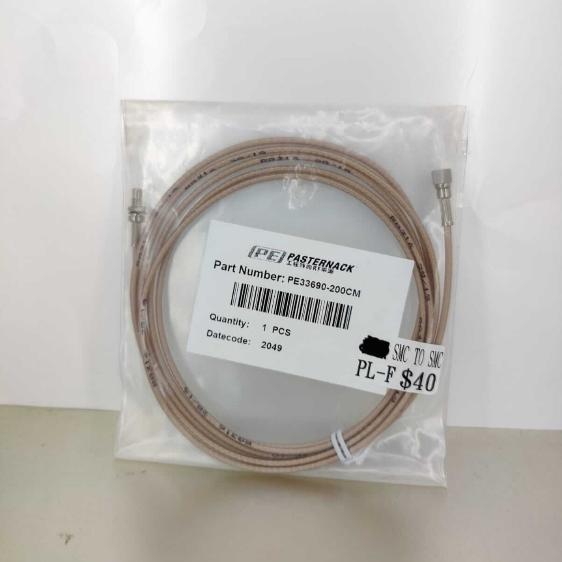 SMC Plug to SMC Jack Bulkhead RG316 Coaxial Cable in packaging, 200cm length, part number PE33690-200CM.