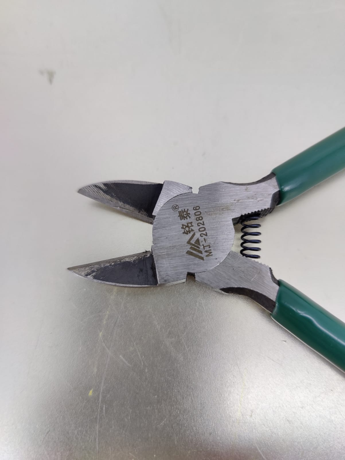 6 inch cable cutter with green handles, designed for precision cutting of wires and cables.