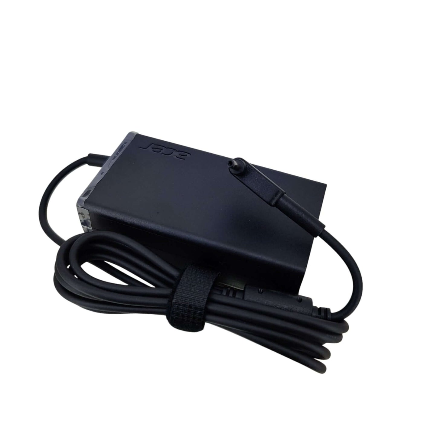 An OEM Acer 65W laptop charger with its 3.0mm x 1.1mm DC connector tip and cable neatly wrapped.