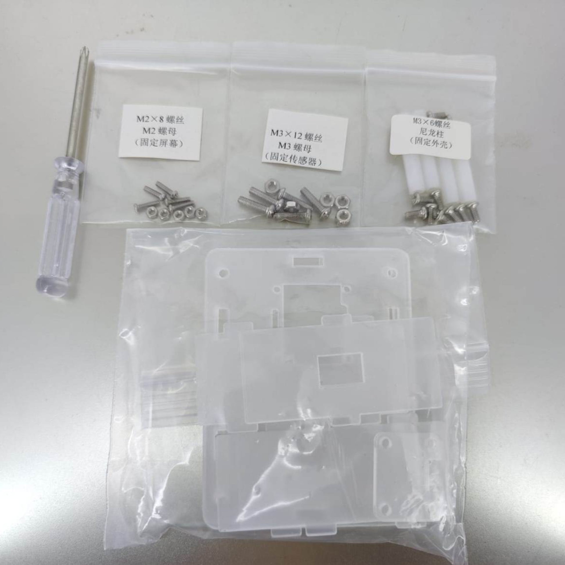 Heart Rate Monitoring Module DIY kit components including screws, screwdriver, and plastic casing for Arduino projects.