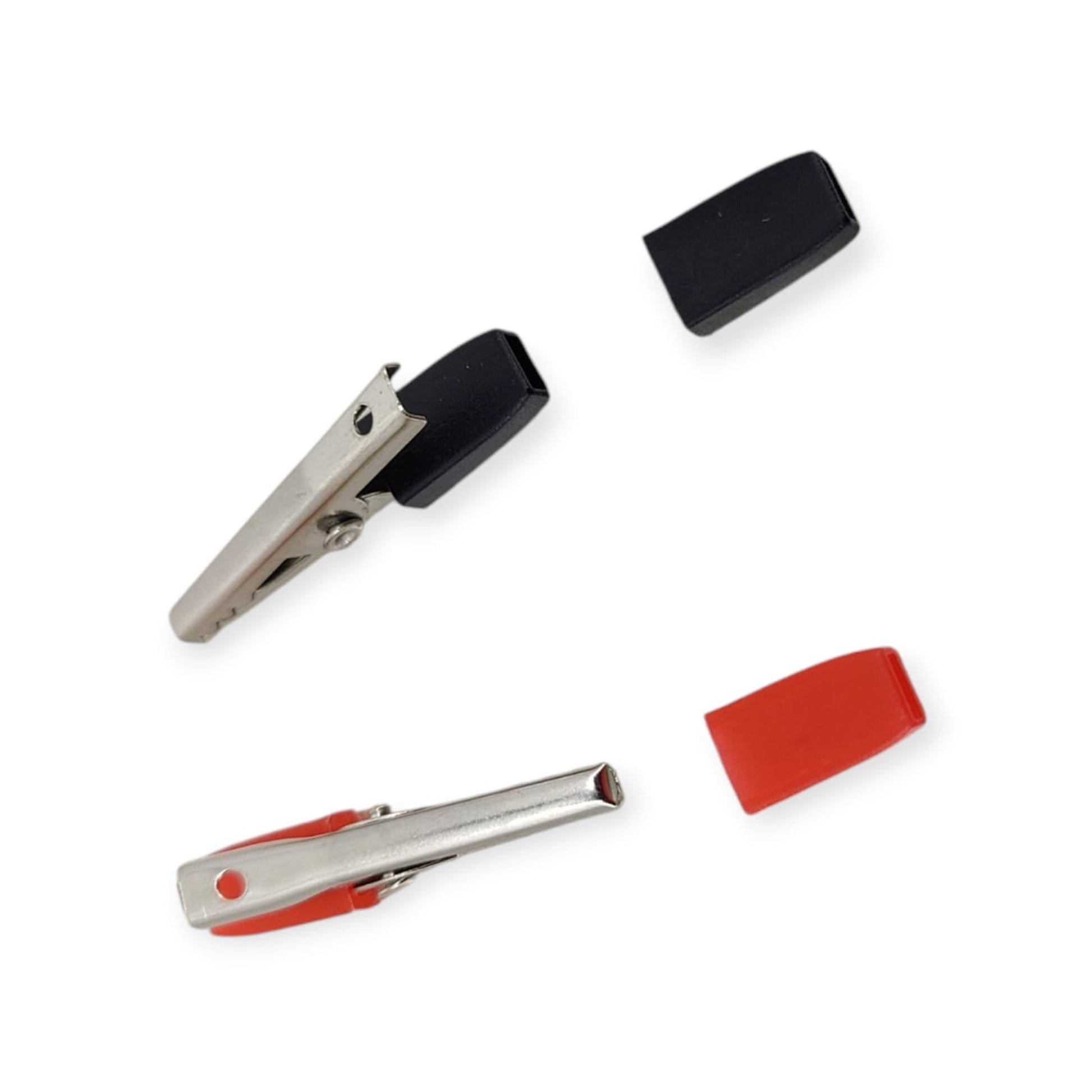 A red and a black alligator clip shown with their protective insulator sleeves removed to display the metal clip body.