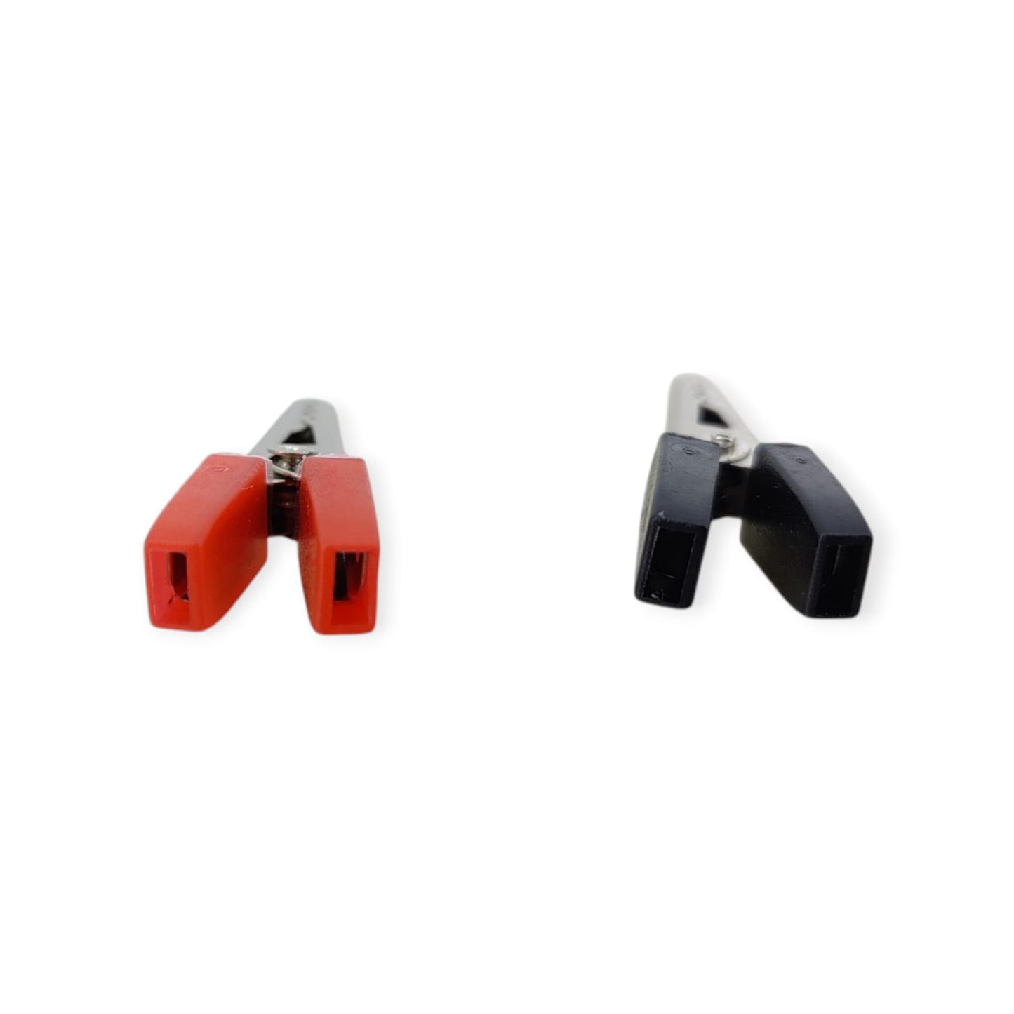 The back view of a red and a black alligator clip, showing the crimp and solder point for wire connection.