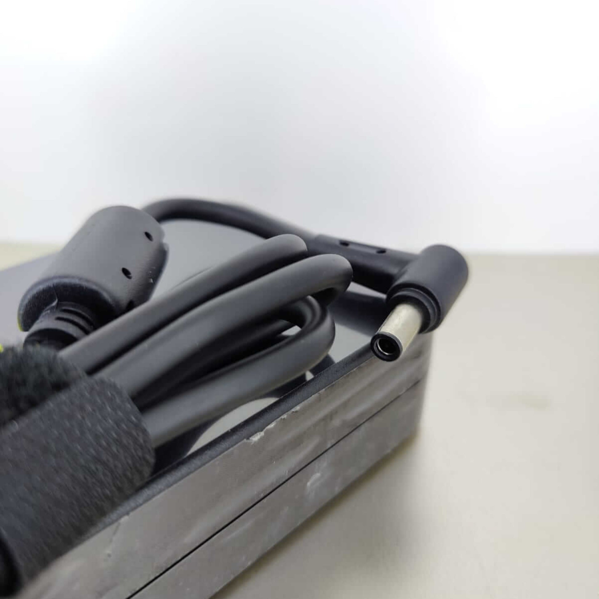 Close-up of the connector tip for ASUS 20V 14A laptop charger, ensuring secure connection.