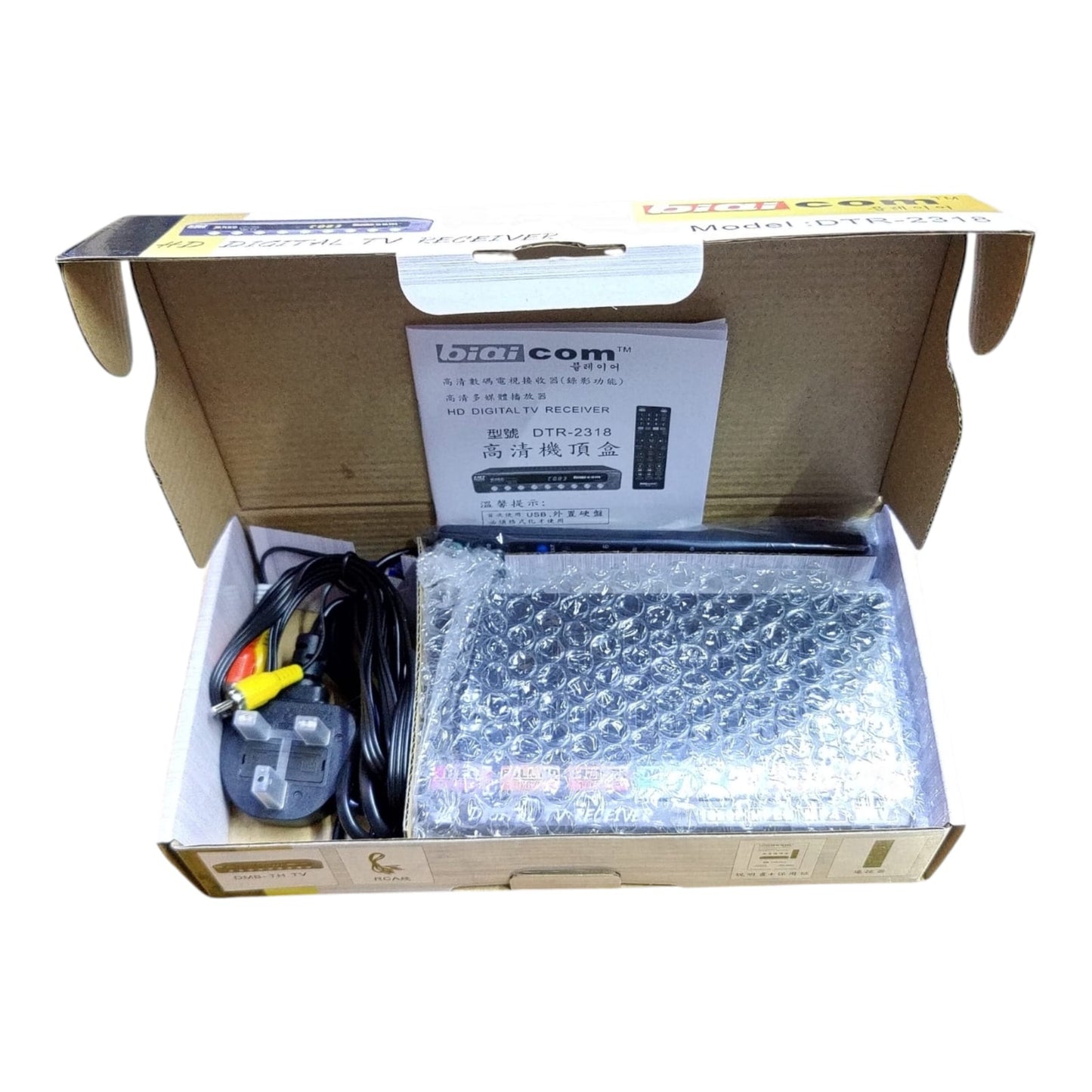 Unboxing Biaicom DTR-2318: Receiver, remote, and manual inside the box.