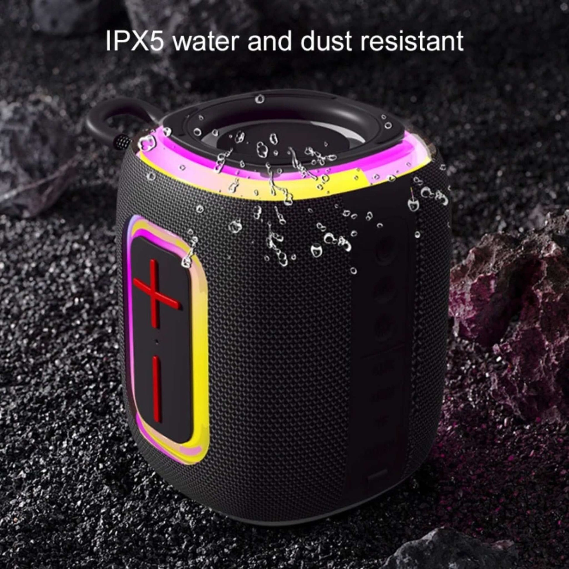 Black Bluetooth speaker with water droplets showing IPX5 water and dust resistance.