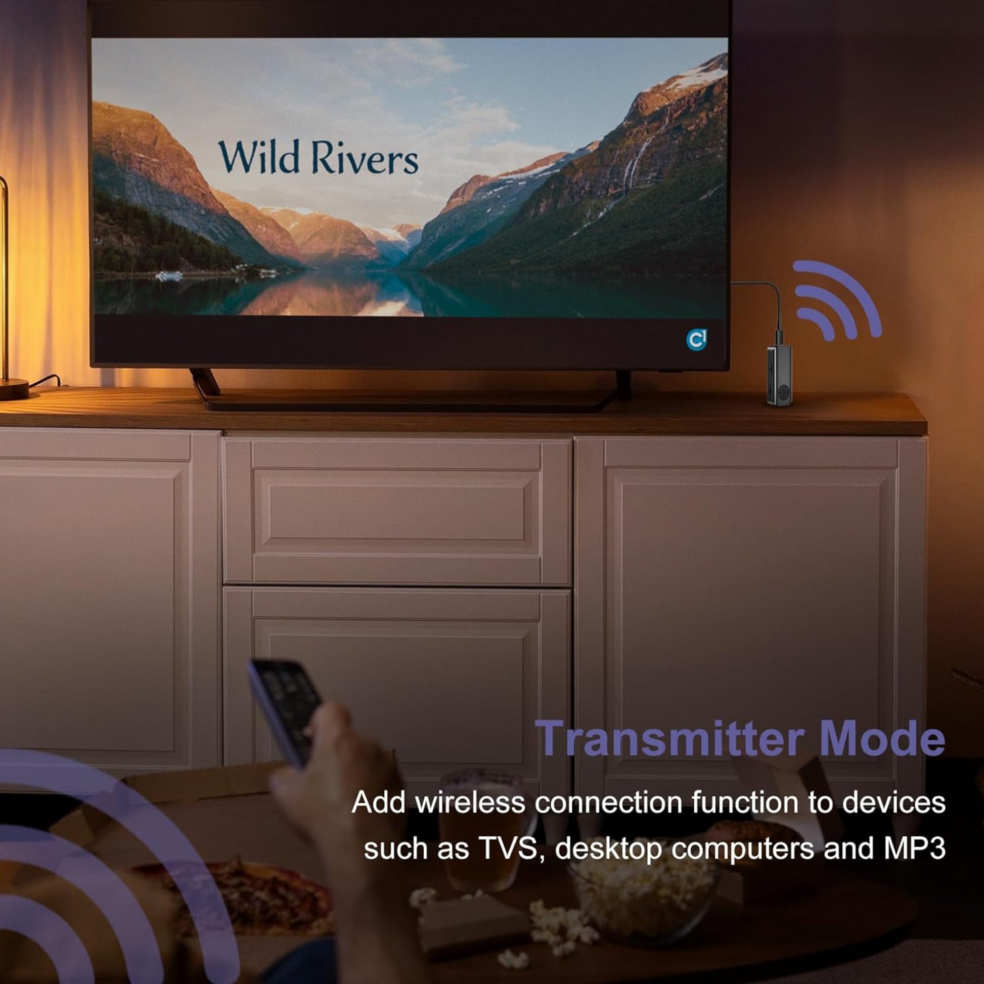 Bluetooth 5.3 adapter in transmitter mode connecting TV to audio devices for wireless streaming.