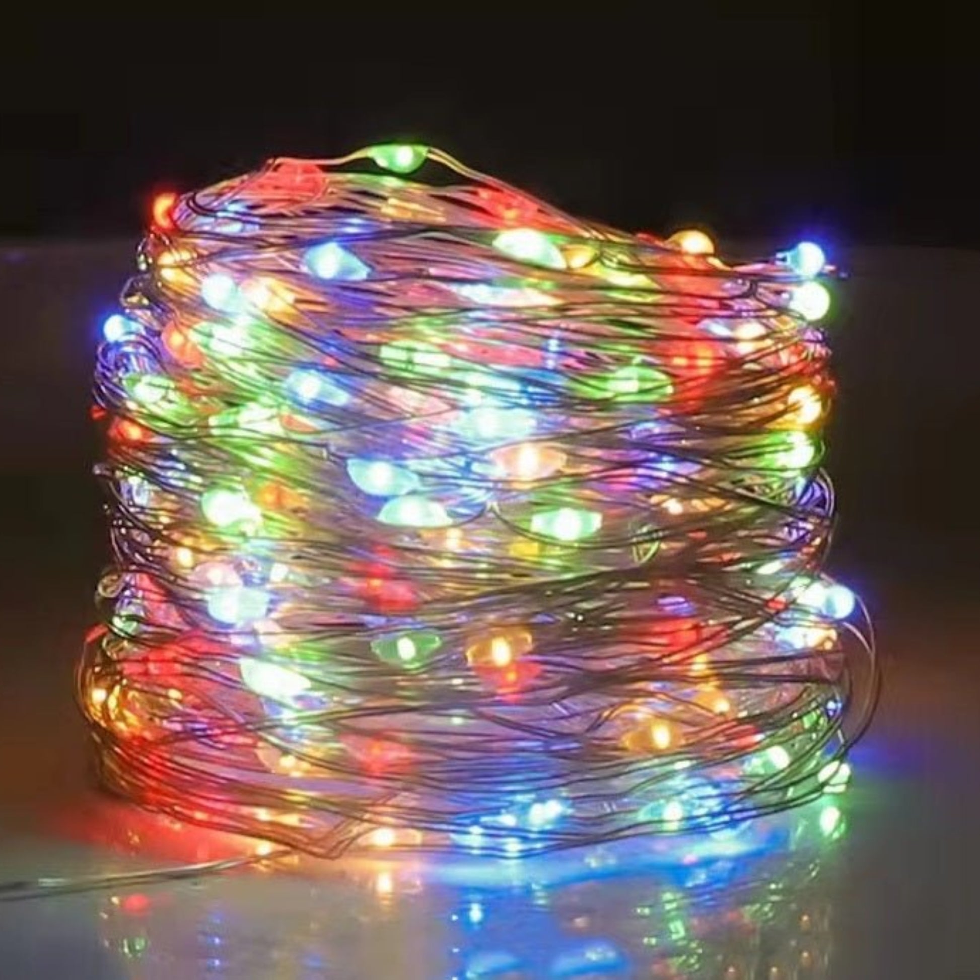 Multicolor USB LED string lights glowing in a decorative coil, perfect for parties and festive occasions.