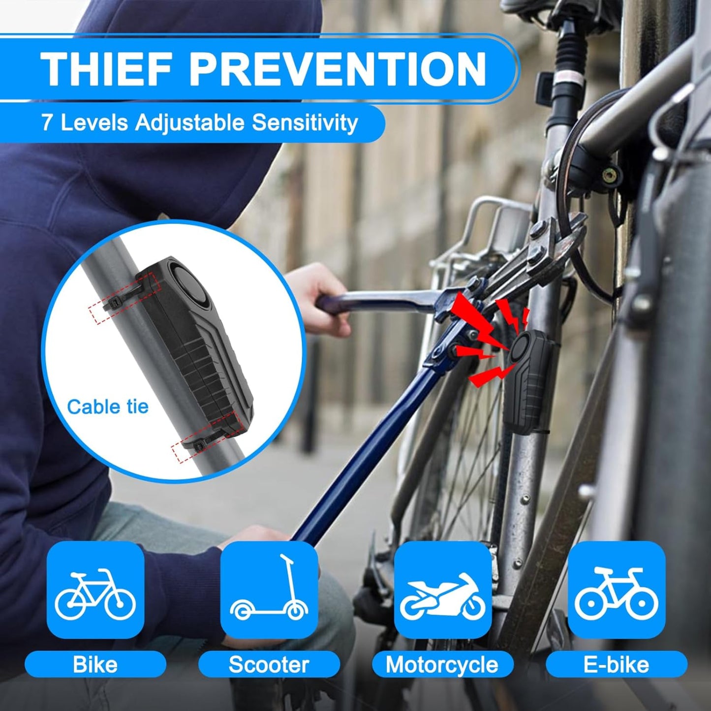 A close-up view of the bike alarm attached with a cable tie, showing its adjustable sensitivity for theft prevention.