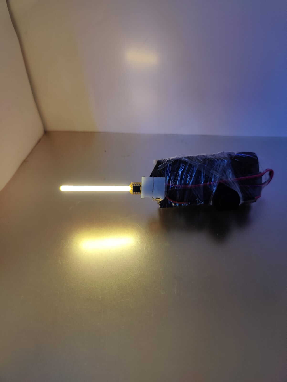 59mm COB LED Meteor Lamp Filament glowing with a captivating light, showcasing its modern design and vibrant lighting effect.