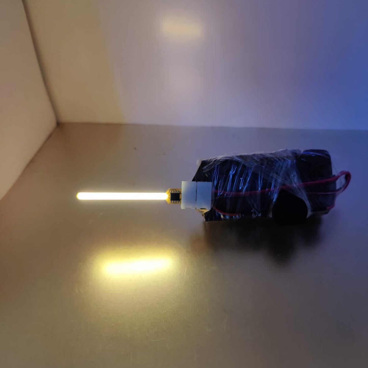 59mm COB LED Meteor Lamp Filament glowing with a captivating light, showcasing its modern design and vibrant lighting effect.