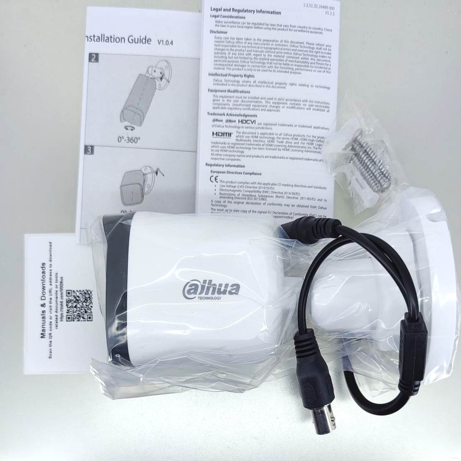 Dahua DH-HAC-B1A21P 2MP HDCVI IR bullet camera with installation guide and cables, ready for setup.