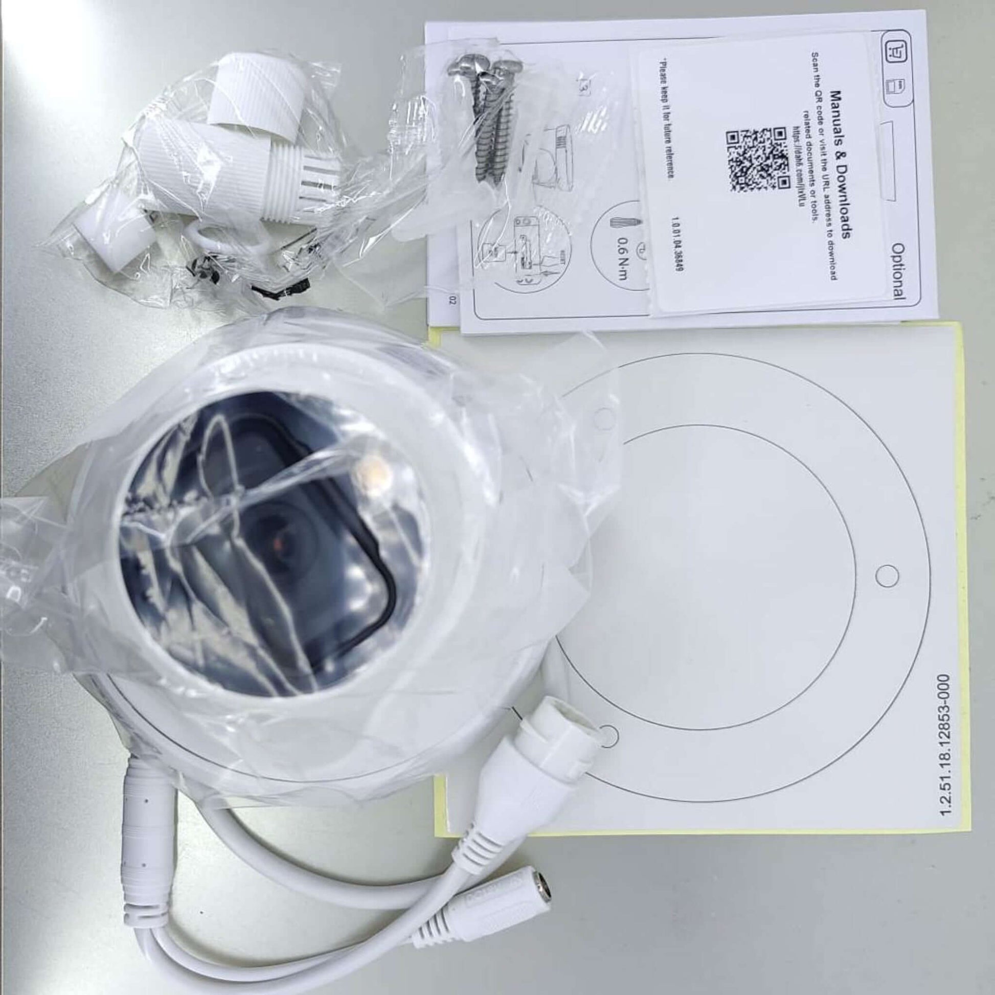 Contents of Dahua DH-IPC-HDW1239T1-LED-S5 camera box: camera, mounting kit, and manual.