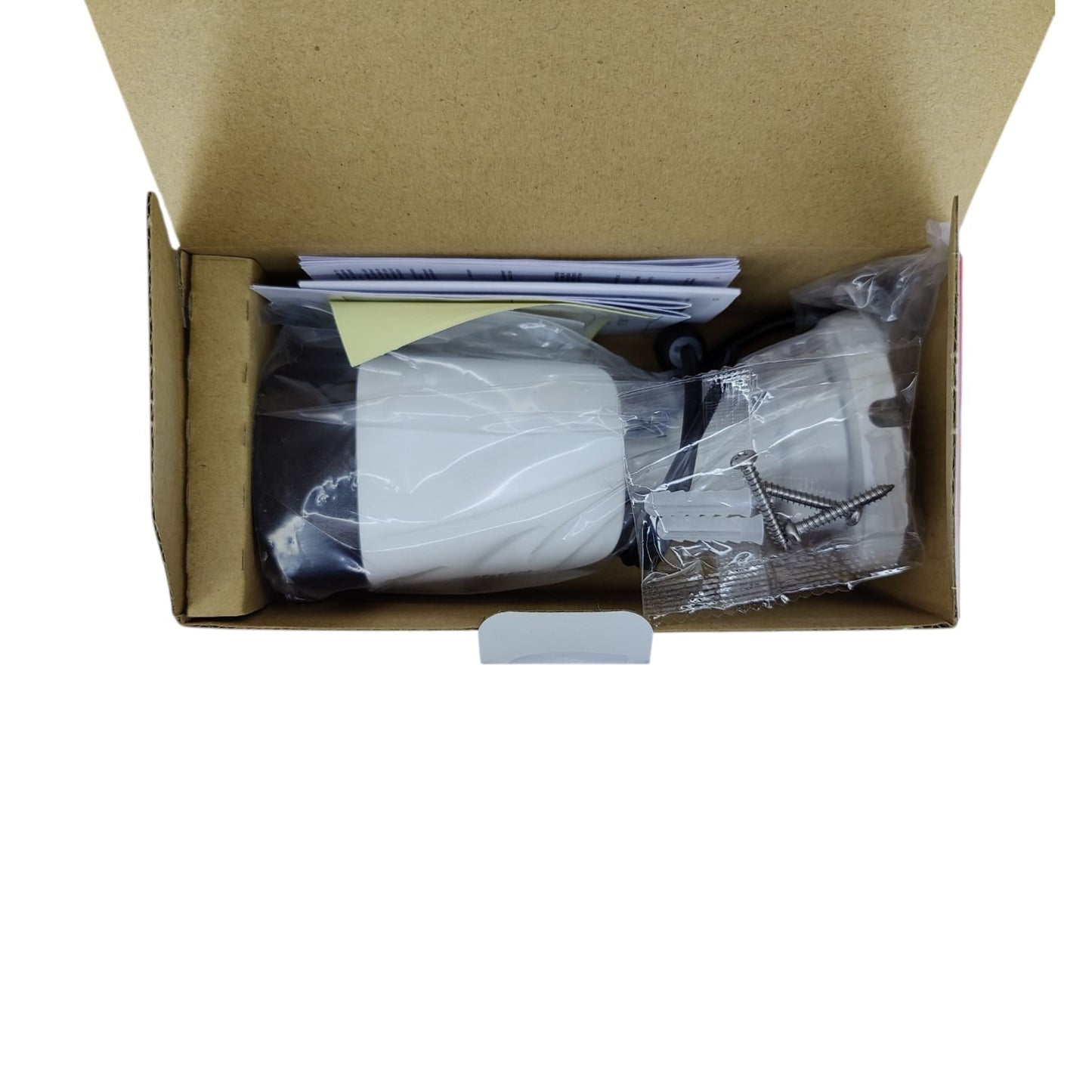 Unboxing Dahua HAC-HFW1500CP-A camera kit: 5MP HDCVI bullet cam, mounting hardware, and manual.