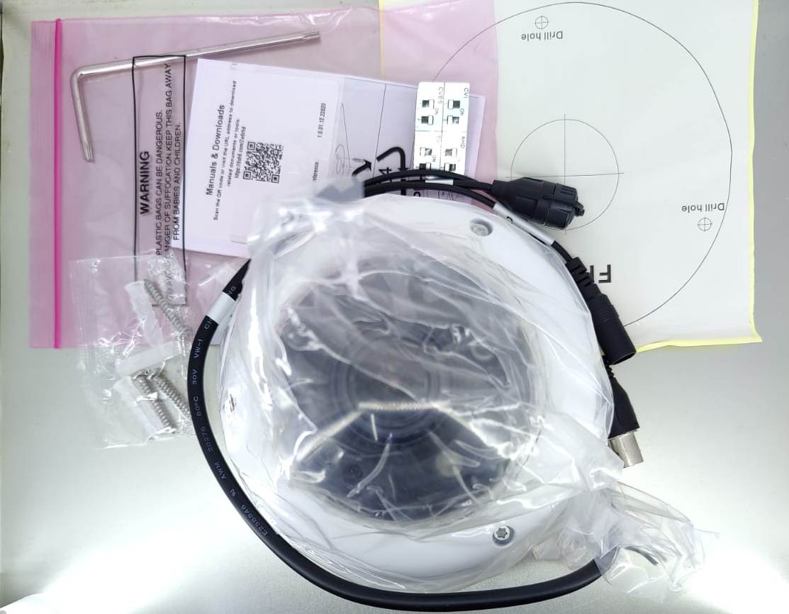 Dahua dome camera installation accessories including cables, mounting template, and hardware.