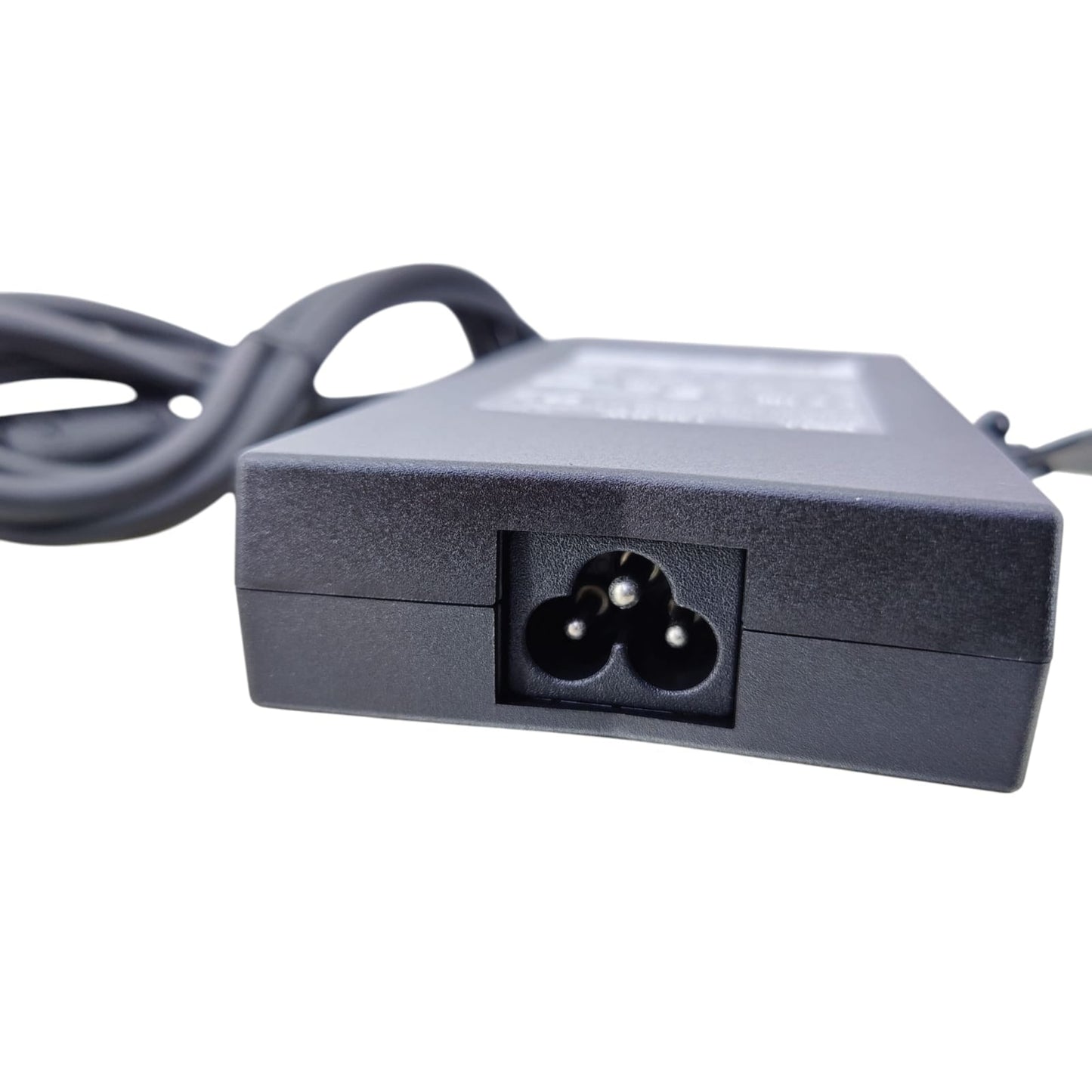 A close-up of the C5 "Mickey Mouse" style power input socket on the Dell 130W laptop charger brick.