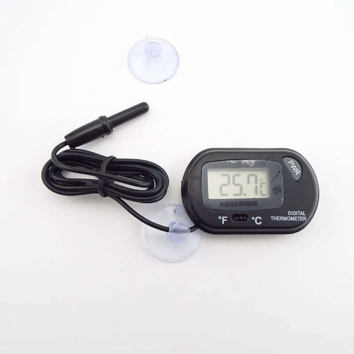 Digital aquarium thermometer displaying 25.7°C, shown with the sensor cable and two suction cups for mounting.