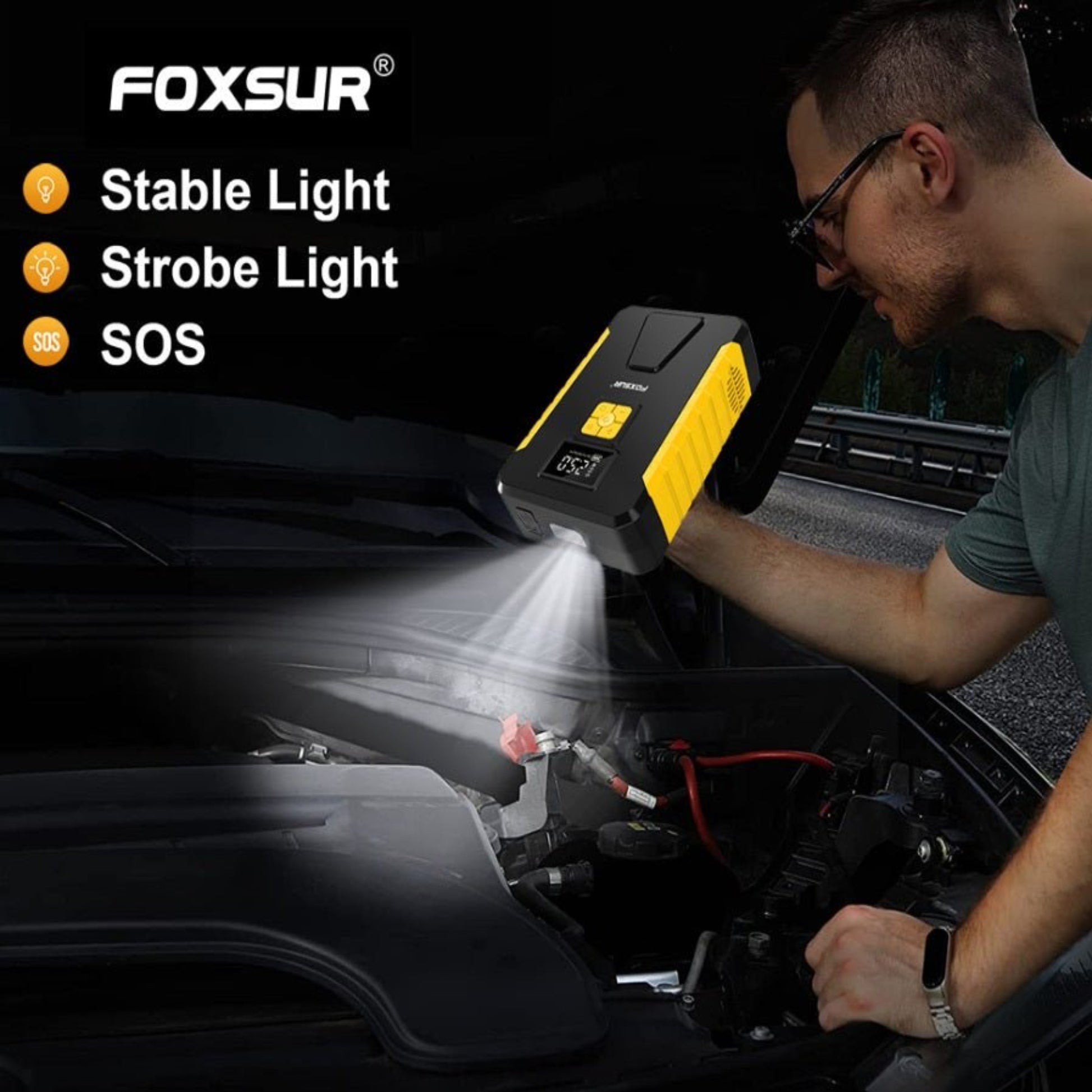 Person using FOXSUR jump starter with light features under car hood, showcasing stable, strobe, and SOS lights.