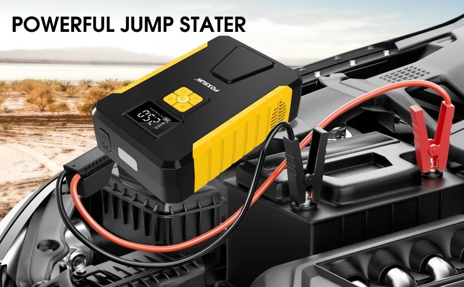 Powerful FOXSUR 12V car jump starter connected to a vehicle for emergency battery boost.