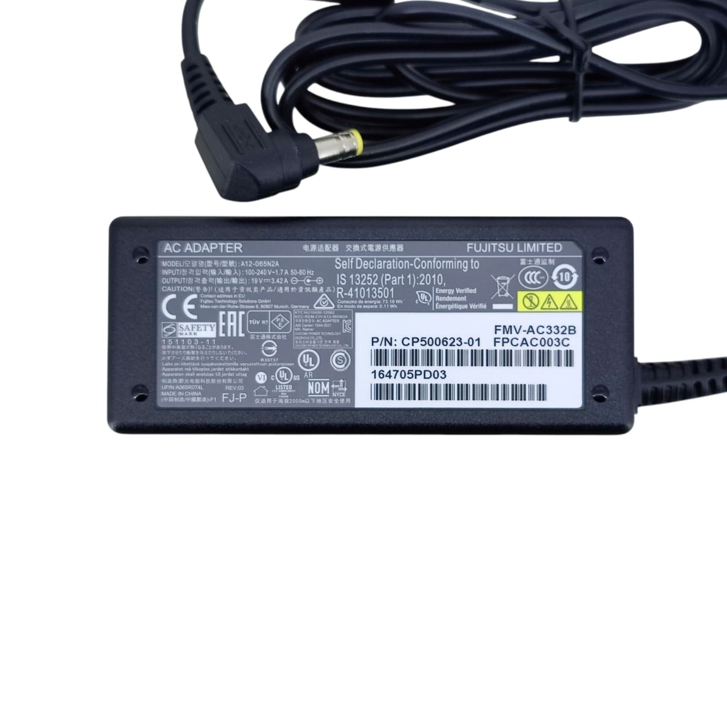 Close-up of the specification label on the Fujitsu 65W adapter, showing part number CP500623-01 and 19V 3.42A output.