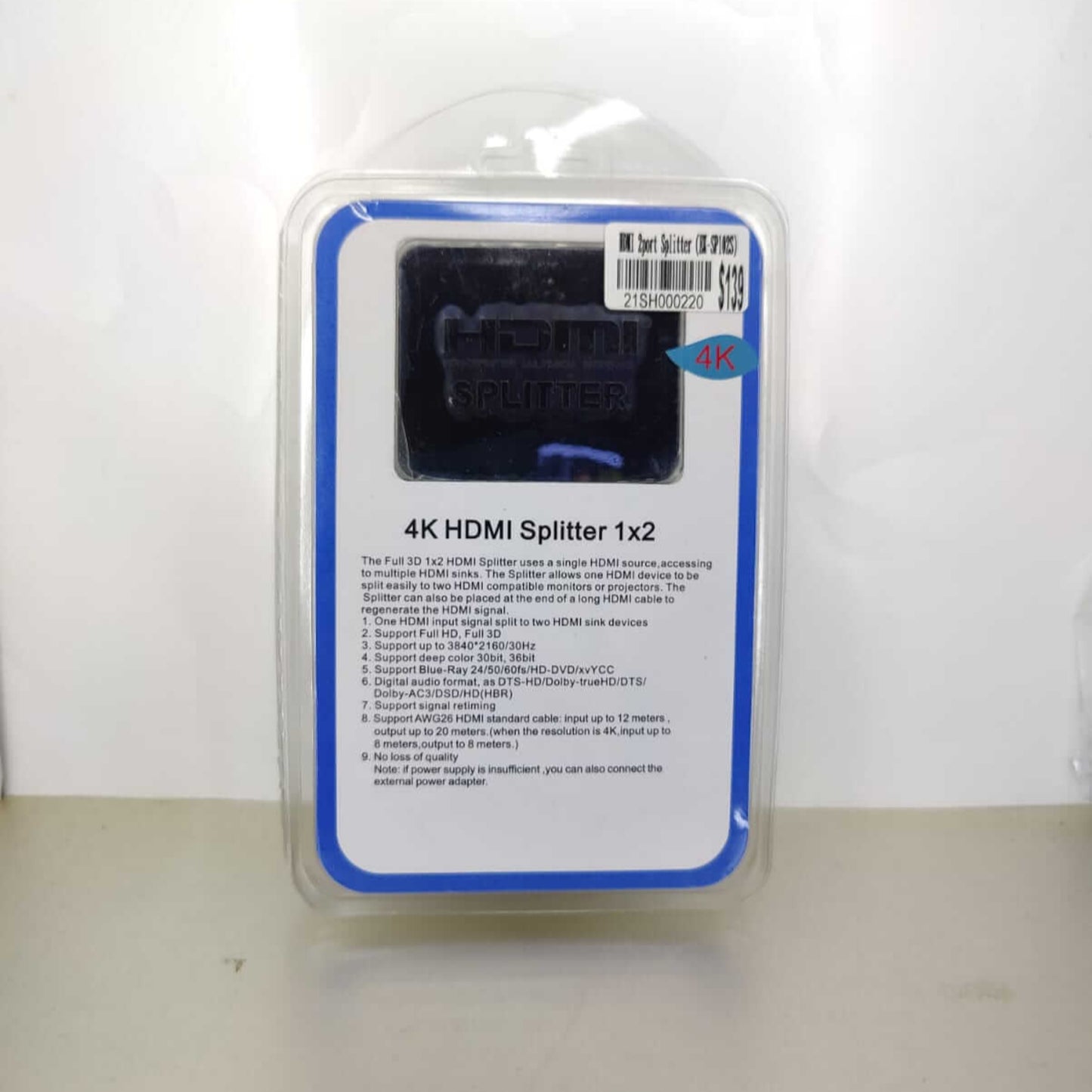 The HDMI splitter is shown in its retail box packaging, highlighting the product's main features and brand.