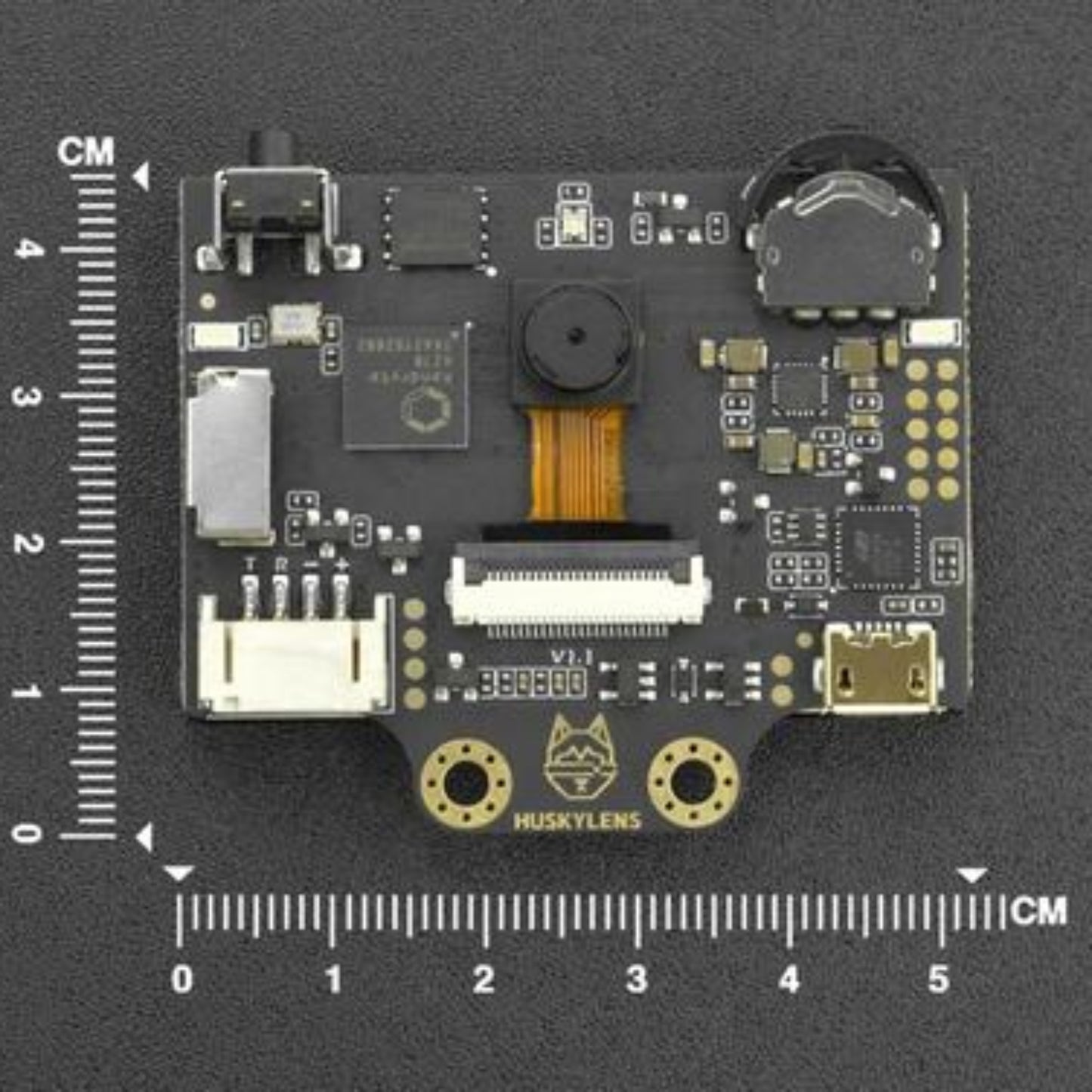 HuskyLens AI machine vision sensor circuit board with measurement scale, ideal for face and object recognition tasks.