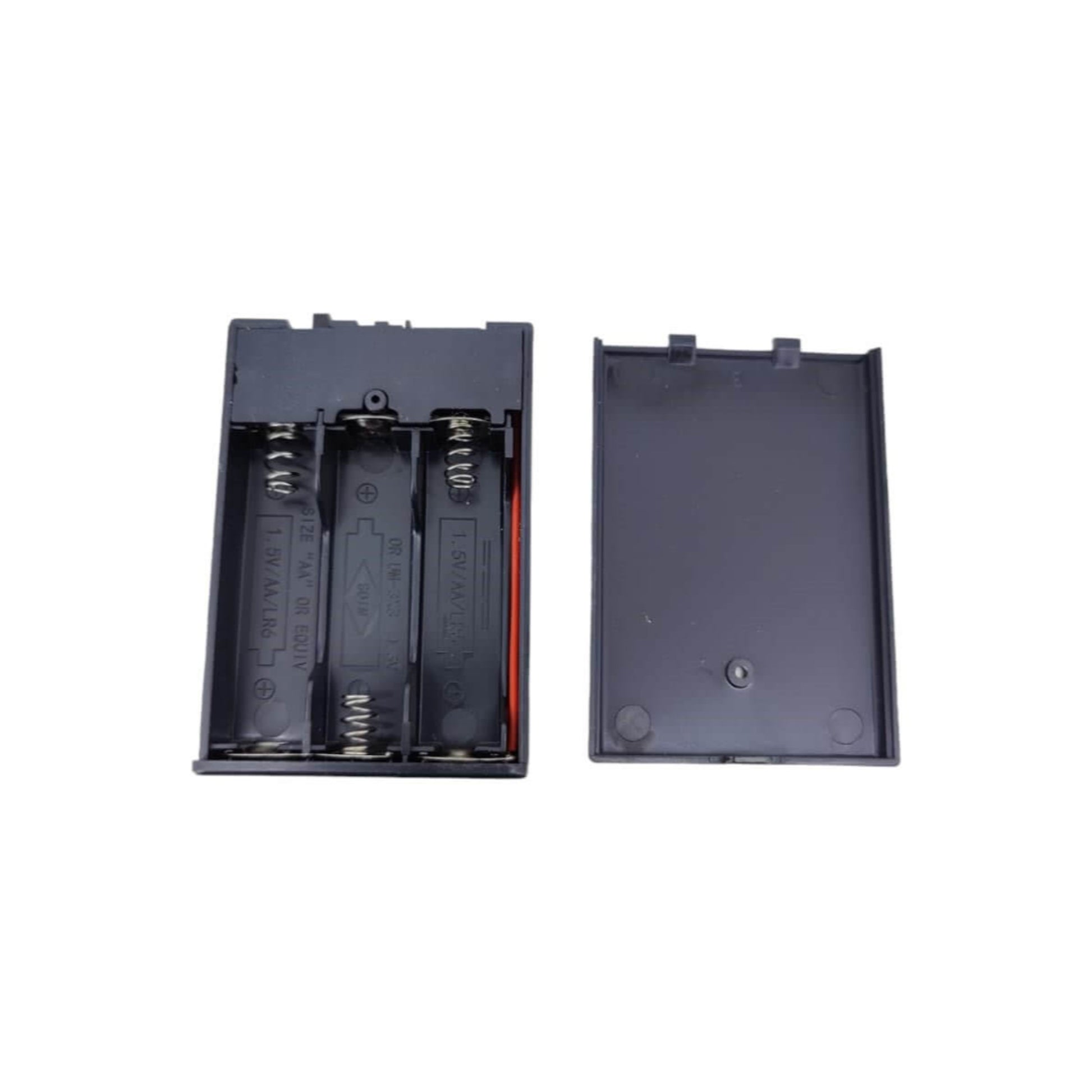 Inside view of the 3xAA battery holder with the cover removed, showing the three compartments for AA batteries.