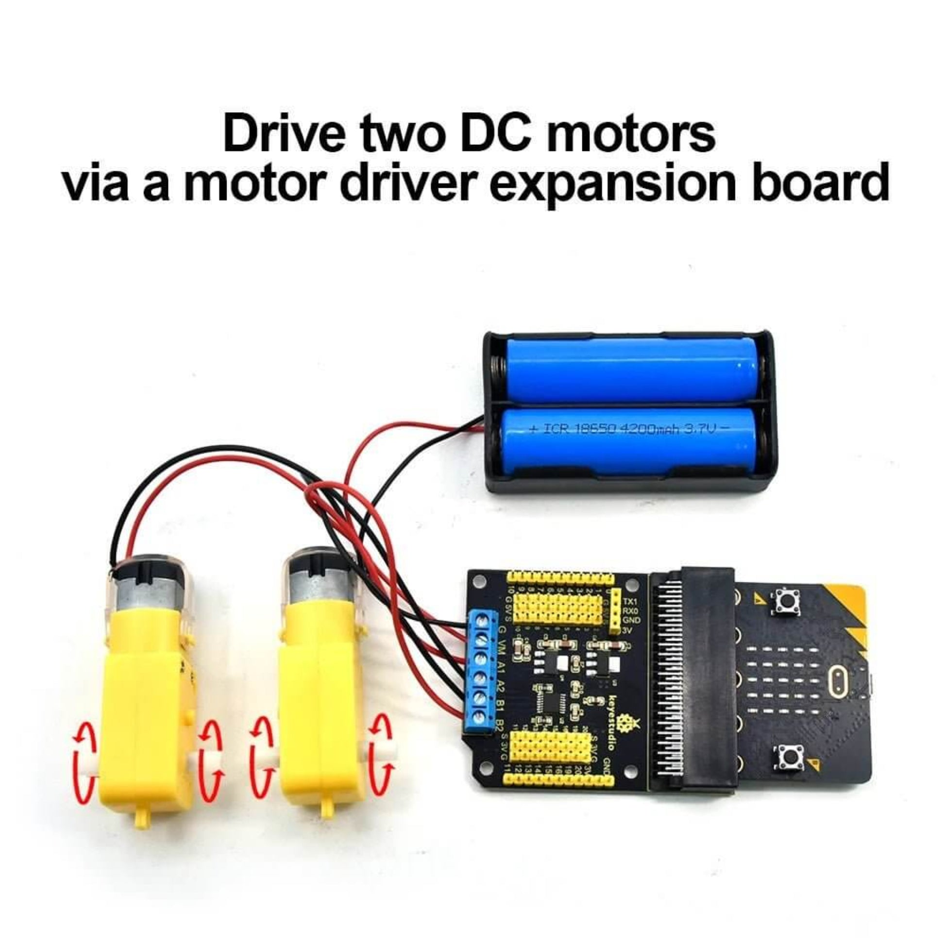 Keyestudio Micro Bit DRV8833 Motor Driver Expansion Board with two yellow DC motors connected.