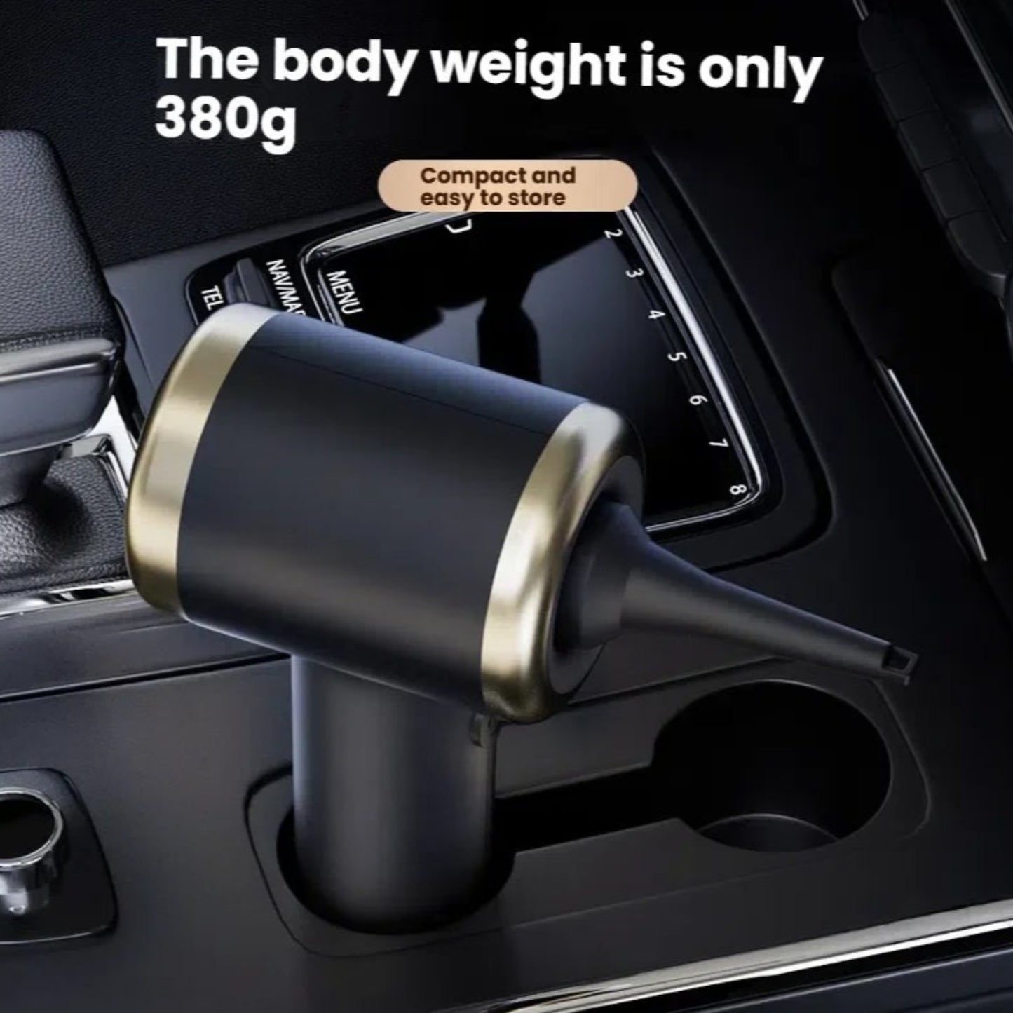 The lightweight 380g portable cordless vacuum cleaner stored conveniently inside a car's center console cup holder.