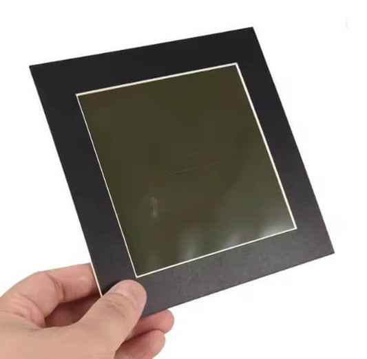 Hand holding 4x4 inch Magnetic Field Viewing Film, demonstrating magnetic flux observation tool.