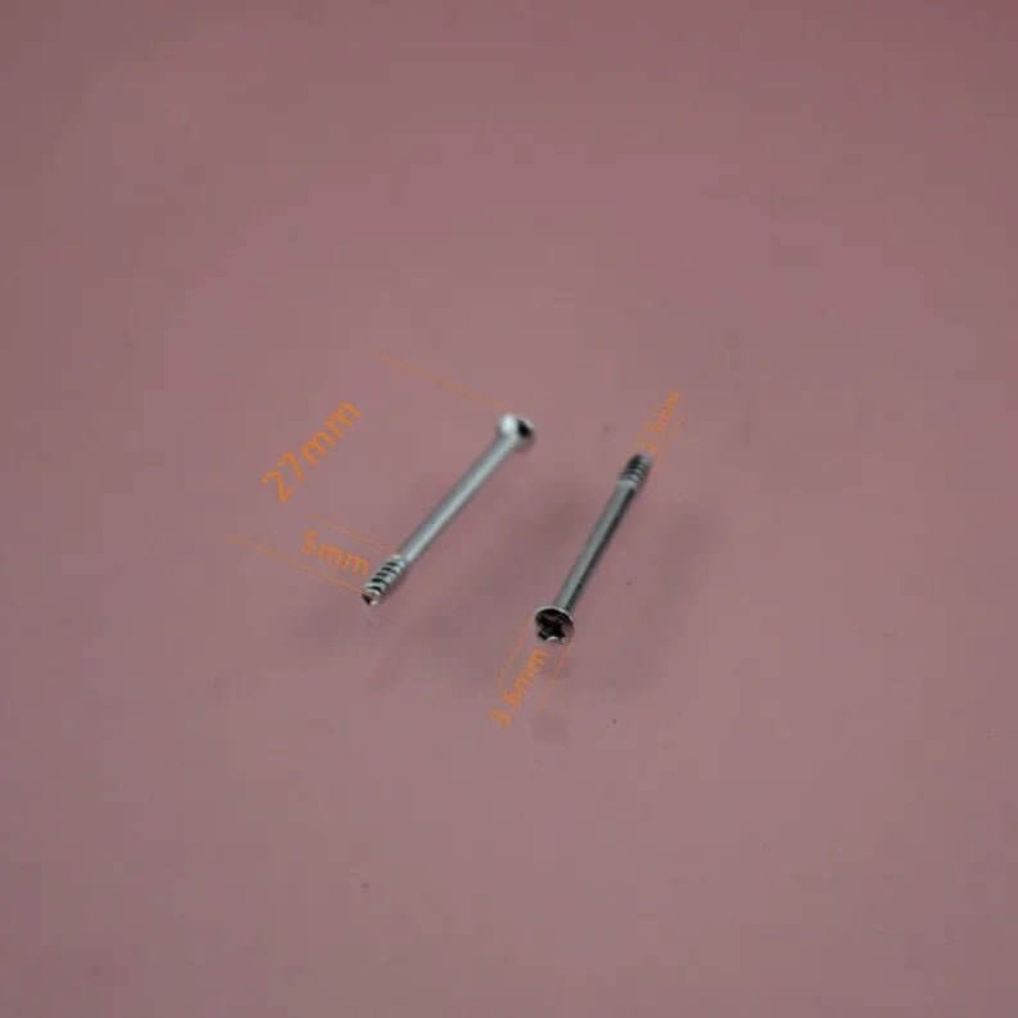 Close-up of two silver screws, 27mm and 1.6mm, for Mecanum wheel assembly.