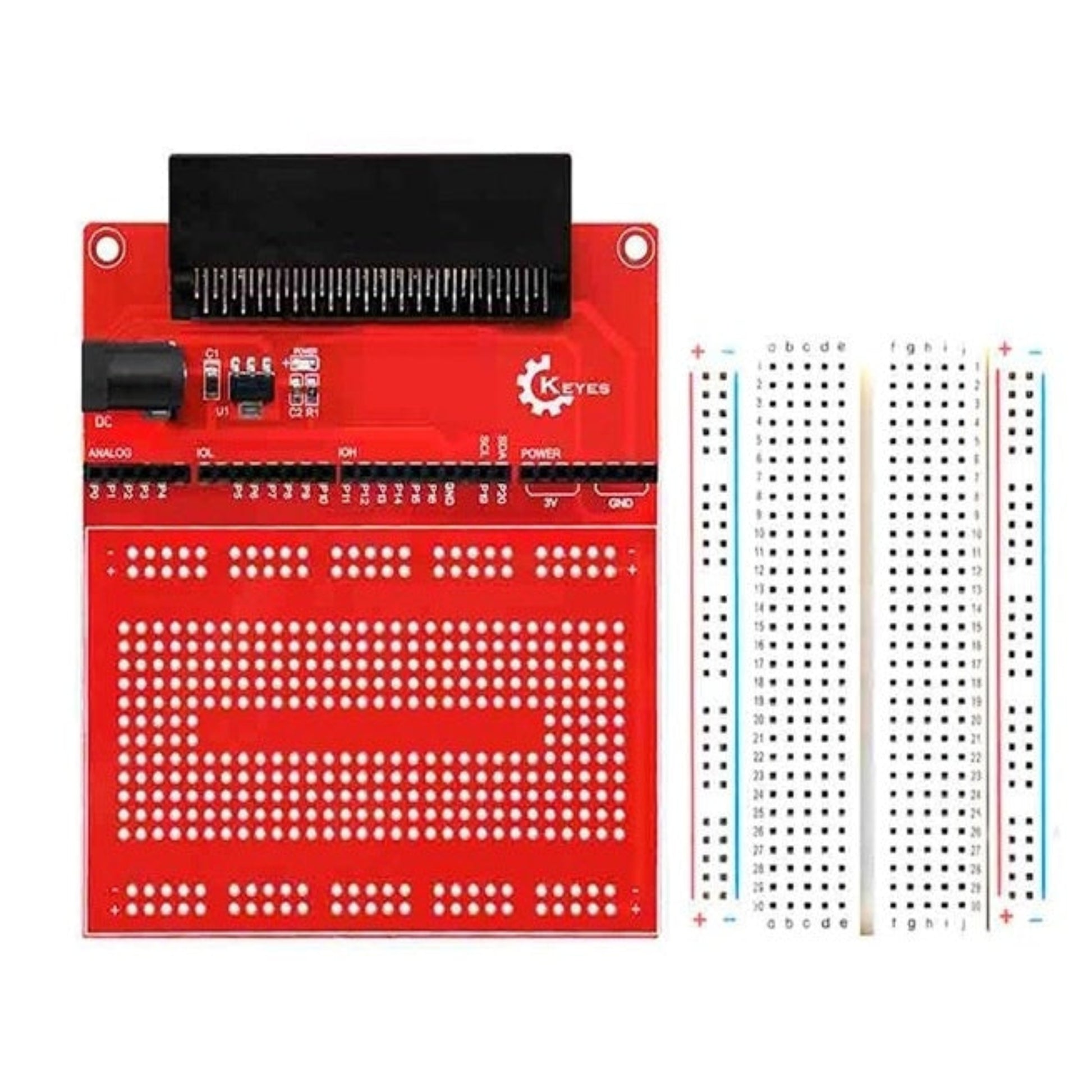 Red Micro:bit prototype extension board shown next to a separate 400-hole white breadboard.