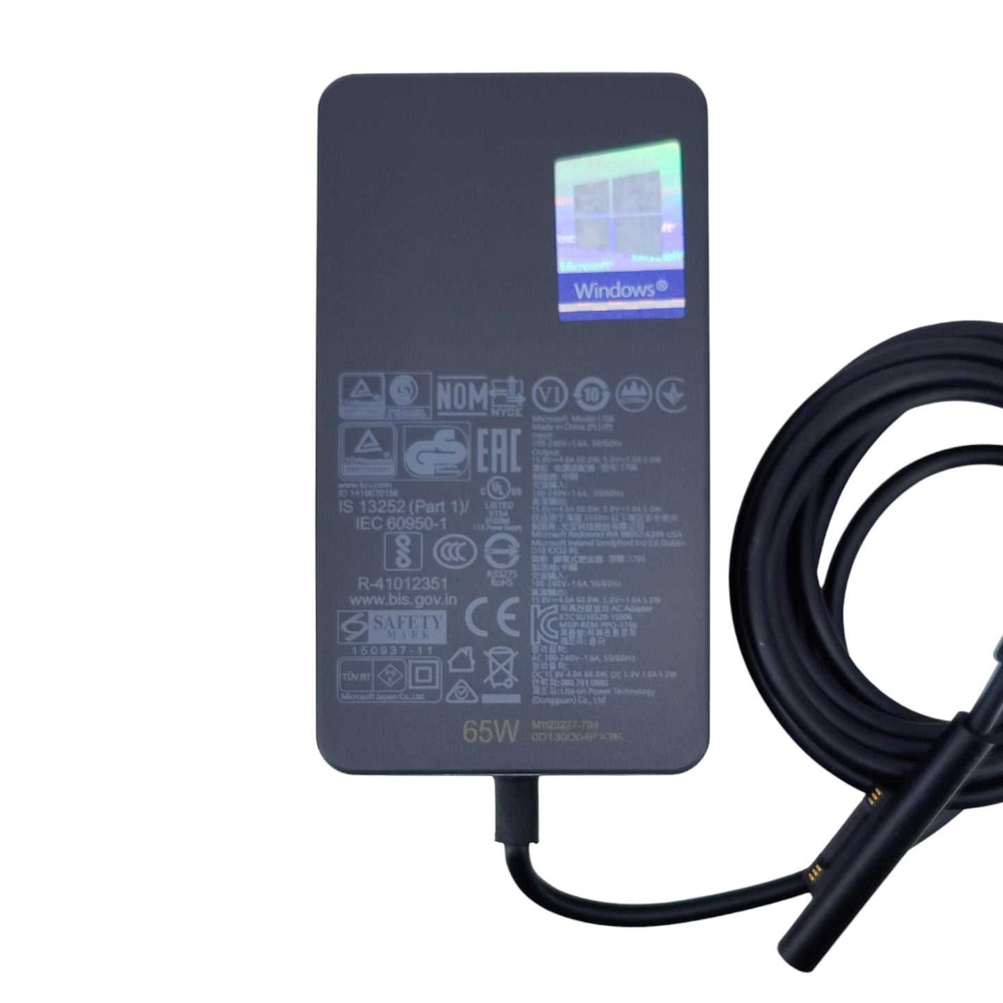 Technical specifications and safety certification label on the Microsoft 65W charger.