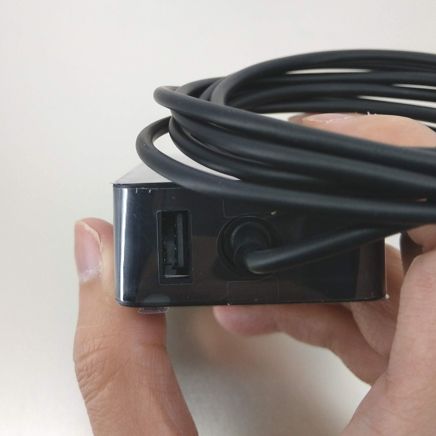 Side view of the Surface Pro charger showing the extra USB charging port.