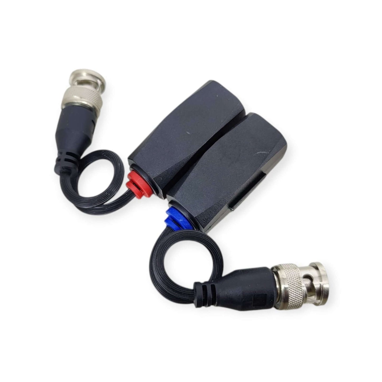 Top-down view of an 8MP passive video balun pair with flexible pigtails and male BNC connectors for security cameras.