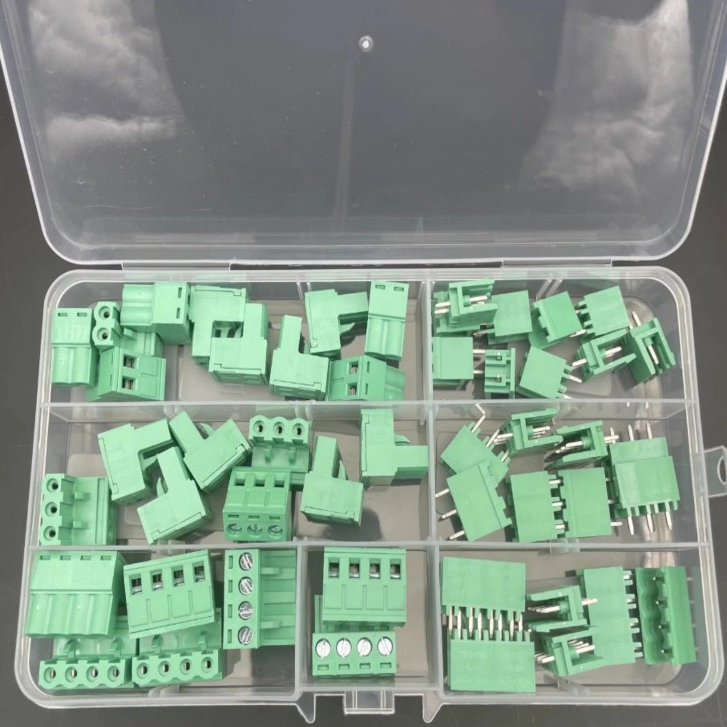 Assorted PCB 5.08mm green terminal block connectors in a storage box, featuring 50 pieces in multiple configurations.