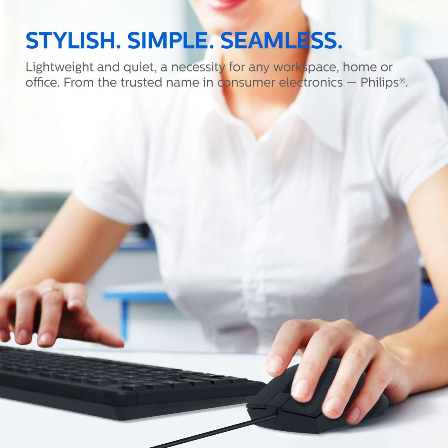 Person using a Philips C234 wired keyboard and mouse, highlighting the stylish, simple, and seamless design.