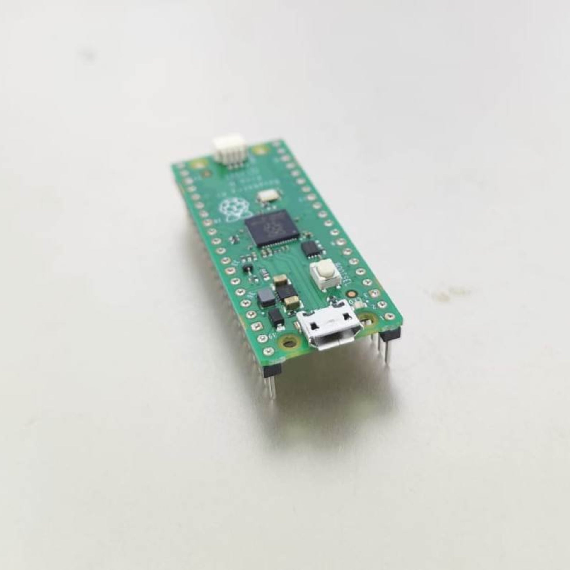 Raspberry Pi Pico H microcontroller board with RP2040 chipset and pre-populated headers for easy project deployment.