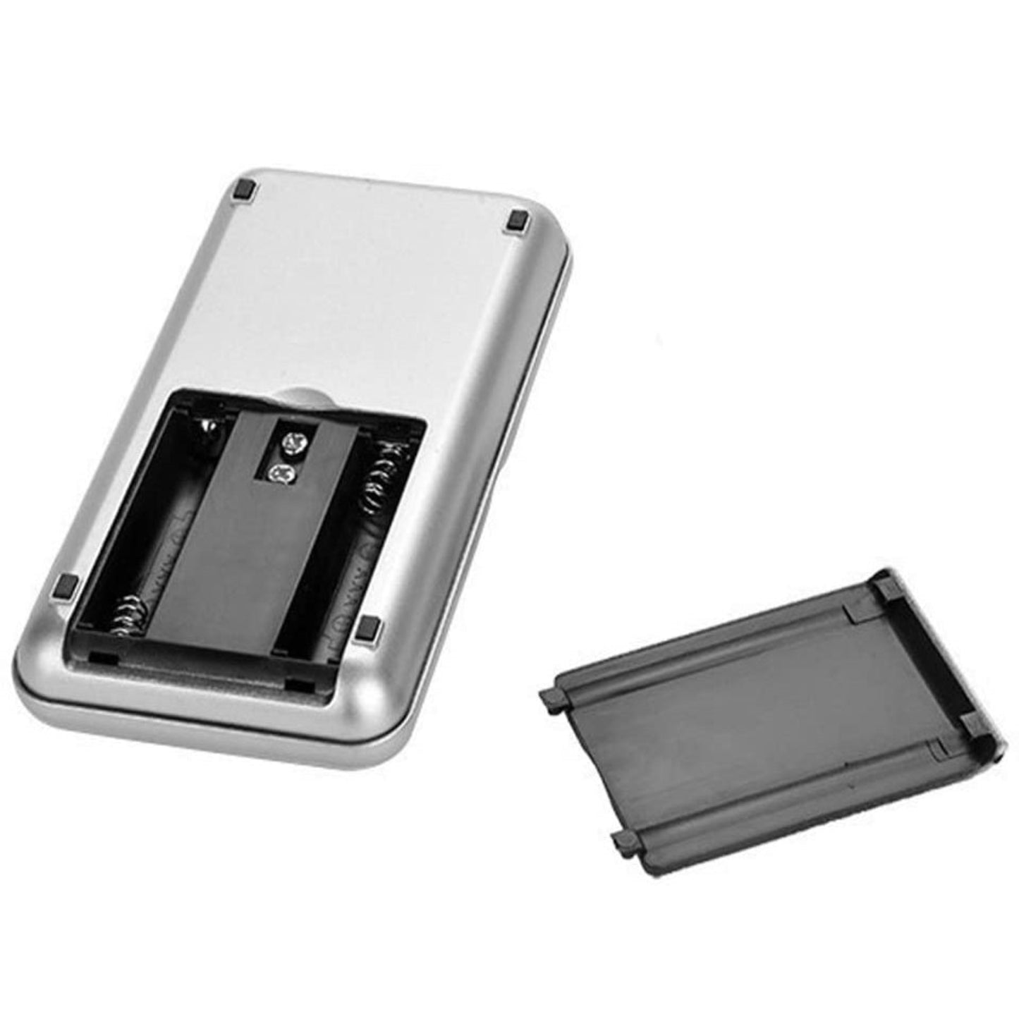 The back of the silver digital scale with the battery cover removed, showing the compartment for two AAA batteries.