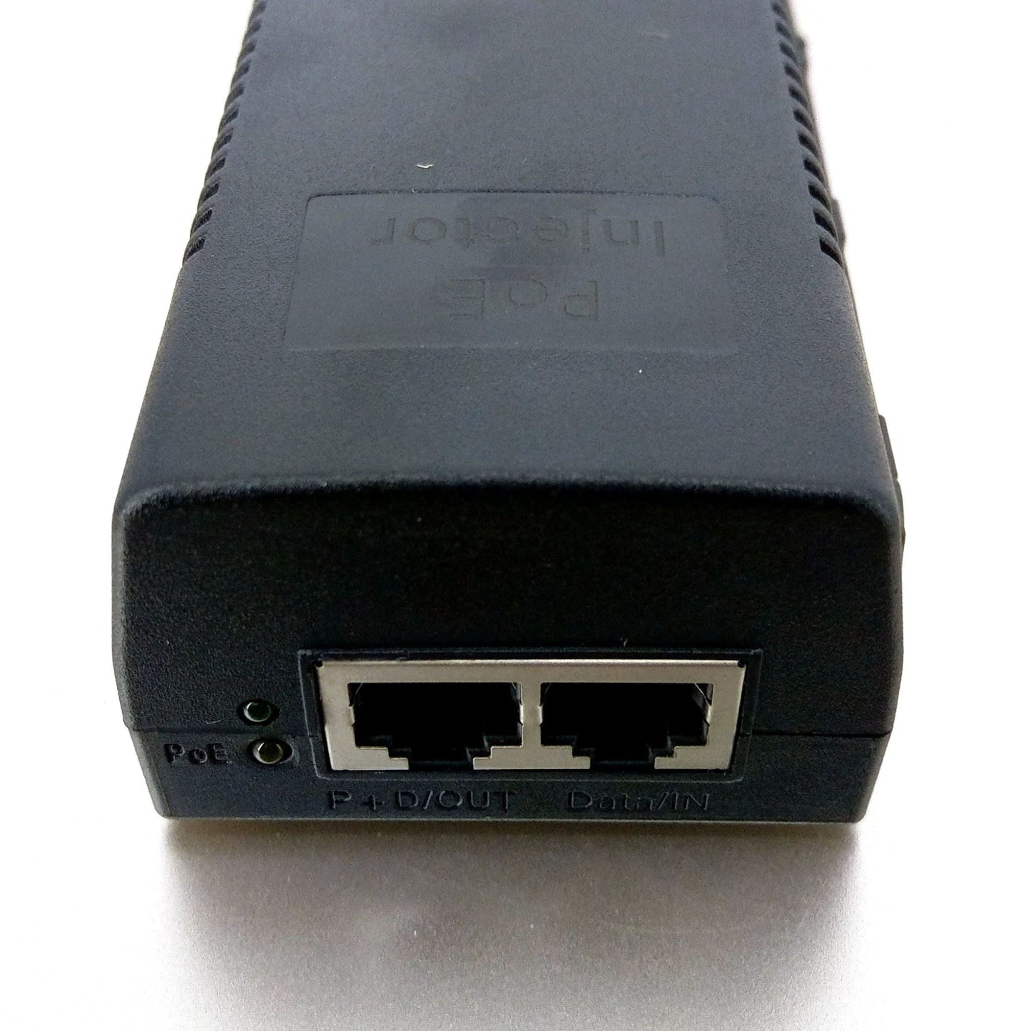 poe-injector-ports-data-in-poe-out.jpg: Close-up of the PoE injector ports, showing the 'P+D/OUT' (PoE Output) and 'Data/IN' (Data Input) RJ45 jacks.