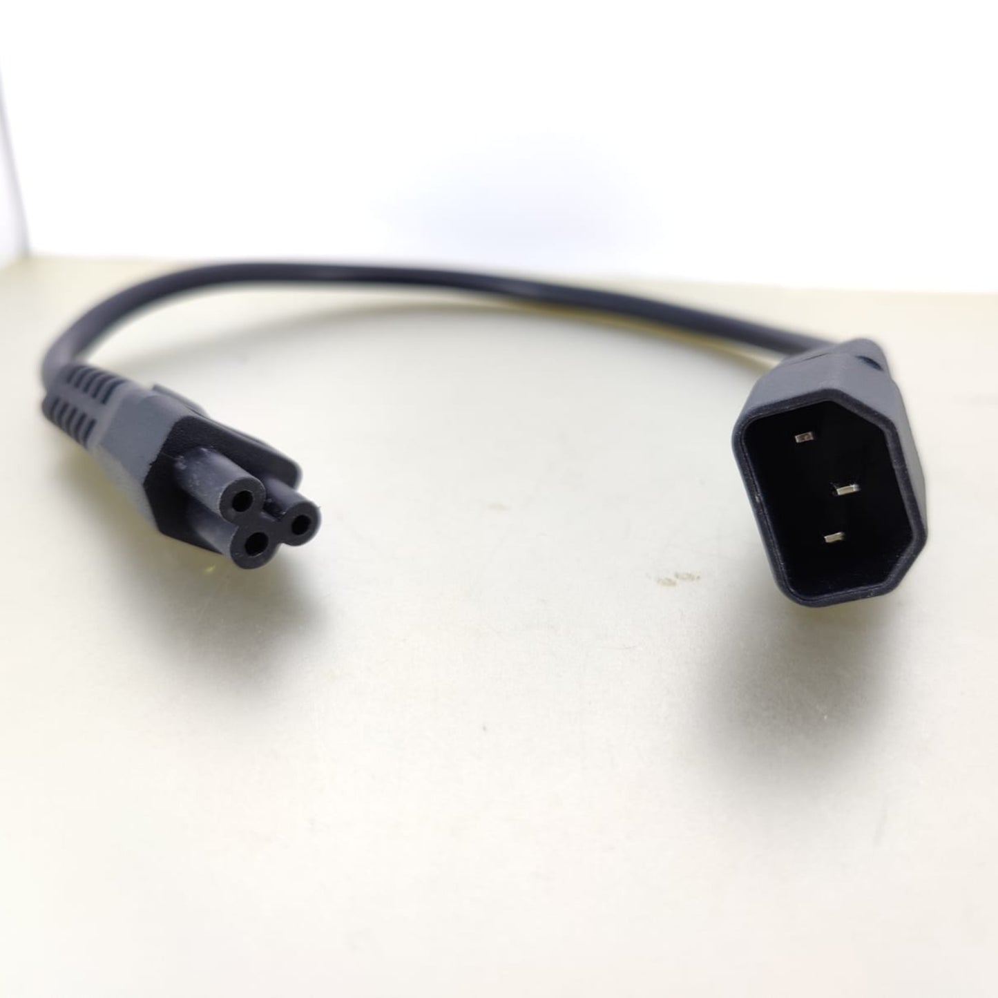 C14 to C5 power adapter cable, one foot long, for connecting devices with IEC connectors.