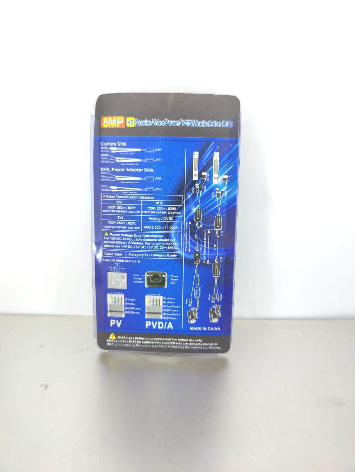 Back view of 8MP 4K Passive Video & Power Balun packaging, detailing specifications and connections for CCTV.