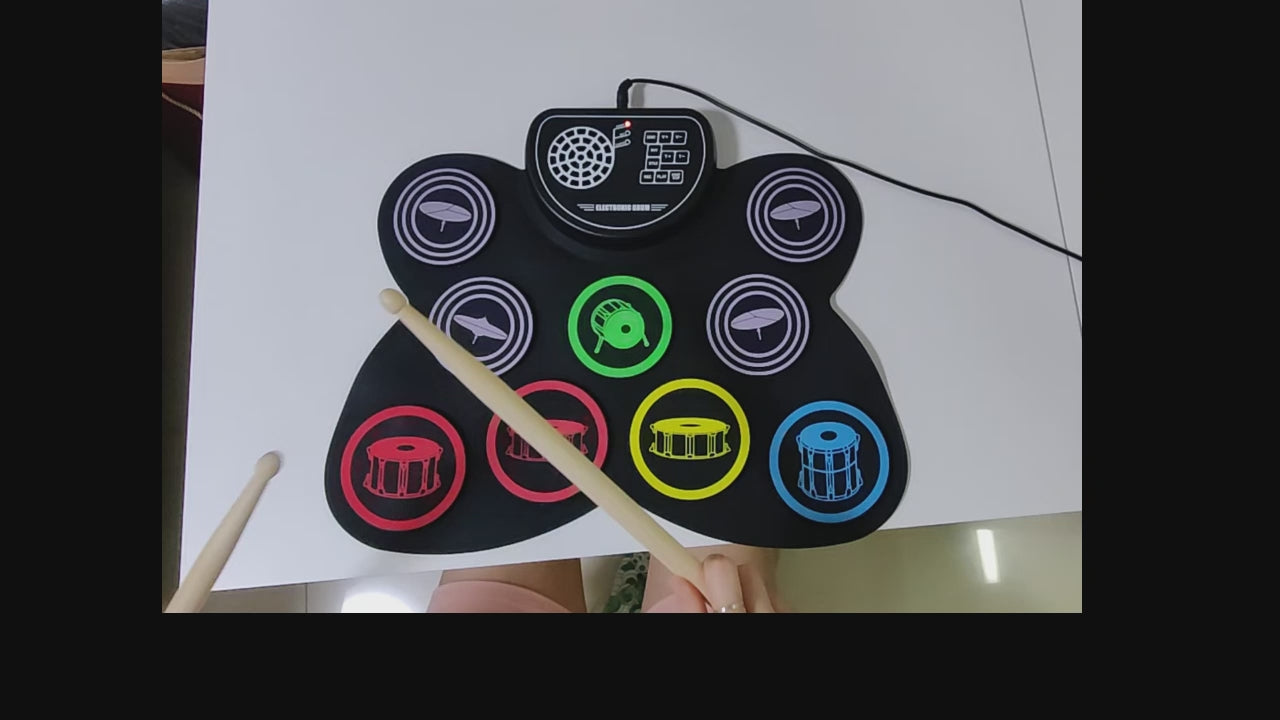 Portable 9-pad electronic drum set for kids and adults, showcasing colorful pads and drumsticks.